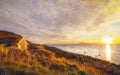 A traditional old house with a roof overgrown with grass and a tent on the beach. Iceland Royalty Free Stock Photo