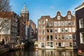 Traditional old houses, canal, bridge, bikes in Amsterdam, Netherlands