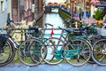 Traditional old houses, canal, bridge, bikes in Amsterdam, Netherlands