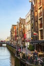 Traditional old houses, canal, bridge, bikes in Amsterdam, Netherlands