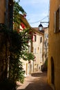 Traditional old houses on narrow winding streets in french town of Hyeres in autumn