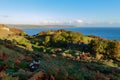 Traditional old irish house on the shores of the atlantic ocean with cloudy sky on sunrise hidden village of galboly Royalty Free Stock Photo