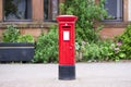 Traditional old red post box for mail and delivery of letters Royalty Free Stock Photo