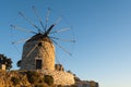 Traditional old stone windmill, iconic building located on all Greek islands Royalty Free Stock Photo