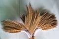 Traditional old Thai brooms on a white floor