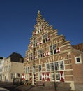 A traditional old vintage dutch house with stepped rooftops and old vintage window shutters in Leiden Royalty Free Stock Photo