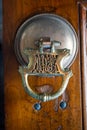 Traditional old vintage ornament on a wooden door handle Royalty Free Stock Photo