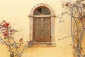 Traditional old window with bougainvillea flowers at Nafplio town Greece Royalty Free Stock Photo