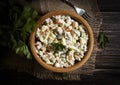 Traditional olivier salad in a dish preparation garnish Royalty Free Stock Photo