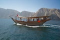 A traditional Omani dhow cruising across sea.