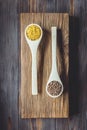 Popular healthy Asian and European cereals red lentil lens culinaris and bulgur in wooden culinary spoons