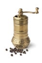 Traditional oriental pepper mill and black pepper Royalty Free Stock Photo