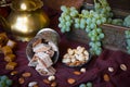 Traditional oriental sweets, nuts and grape. Metal and copper kitchen tools
