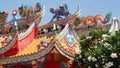 Traditional oriental taoist chinese monastery temple roof details, festive dragon decoration. Classic asian religious multicolor Royalty Free Stock Photo