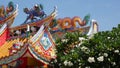 Traditional oriental taoist chinese monastery temple roof details, festive dragon decoration. Classic asian religious multicolor