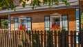 Traditional ornamented colorful open shutters of an old wooden Polish rural house in the village of TrzeÃâºcianka.