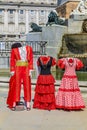 Traditional flamenco and matador costumes photo props at the fountain in Plaza de Oriente Royal Palace in Madrid, Spain