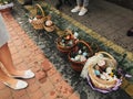 Traditional orthodox Easter food for blessing. Easter baskets with stylish painted eggs, easter cake, ham, butter, candle with