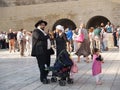 Traditional orthodox Judaic family on the square in front of the