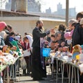 Traditional orthodox paschal ritual - priest blessing easter egg