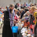 Traditional orthodox paschal ritual - priest blessing easter egg