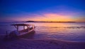 Traditional outrigger fishing boat in Gili Meno island Idonesia after sunset Royalty Free Stock Photo