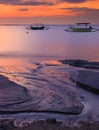 Traditional outrigger fishing boats silhouetts against a sunset, Bali Indonesia Royalty Free Stock Photo