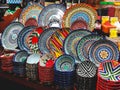 Traditional painted dishes and cups on the counter of the oriental market