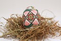 Traditional painted handmade Easter egg on hay Royalty Free Stock Photo