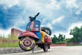 Traditional painted scooter landscape background