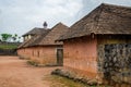 Traditional palace of the Fon of Bafut with brick and tile buildings and jungle environment, Cameroon, Africa Royalty Free Stock Photo