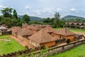 Traditional palace of the Fon of Bafut with brick and tile buildings and jungle environment, Cameroon, Africa