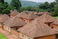 Traditional palace of the Fon of Bafut with brick and tile buildings and jungle environment, Cameroon, Africa Royalty Free Stock Photo