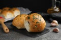 Traditional pampushka buns with garlic and herbs on grey table, closeup Royalty Free Stock Photo