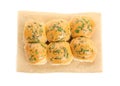 Traditional pampushka buns with garlic and herbs on white background, top view Royalty Free Stock Photo