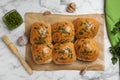 Traditional pampushka buns with garlic and herbs on white marble table, flat lay Royalty Free Stock Photo