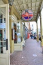 Traditional passage corridor design with Bubba Gump Shrimp Restaurants sign along Decatur Street in French Quarter