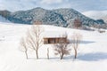 Traditional peasant house covered with snow in the Pestera Village near Moeciu and Bran Romania