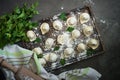 Traditional pelmeni or dumpling at cutting board.