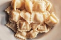 Traditional pelmeni, ravioli, dumplings filled with meat on plate