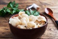 Traditional pelmeni, ravioli, dumplings filled with meat on plate, russian kitchen. Wooden rustic background, copy space Royalty Free Stock Photo