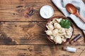 Traditional pelmeni, ravioli, dumplings filled with meat on plate, russian kitchen. Wooden rustic background, copy space Royalty Free Stock Photo