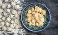 Traditional pelmeni, ravioli, dumplings with meat on a dark background. banner, menu, recipe place for text, top view Royalty Free Stock Photo