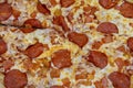 Traditional pepperoni pizza. Close-up. Abstract background from pizza. Delicious food concept Royalty Free Stock Photo