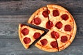 Pepperoni pizza with cut slices, top view on a wood background Royalty Free Stock Photo
