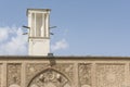 Traditional persian courtyard- Borujerdi house landmark windtower detail in front of blue sky