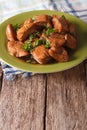 Traditional Philippine Food: Adobo chicken with herbs on a plate