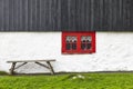 Traditional picturesque faroe islands house with black wooden roof