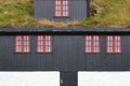 Traditional picturesque faroe islands house with green roof