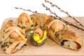 Traditional pie with eggs, Easter decoration and willow branches